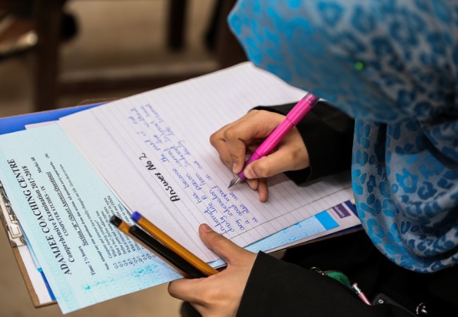 Students studying at Adamjee Coaching Centre